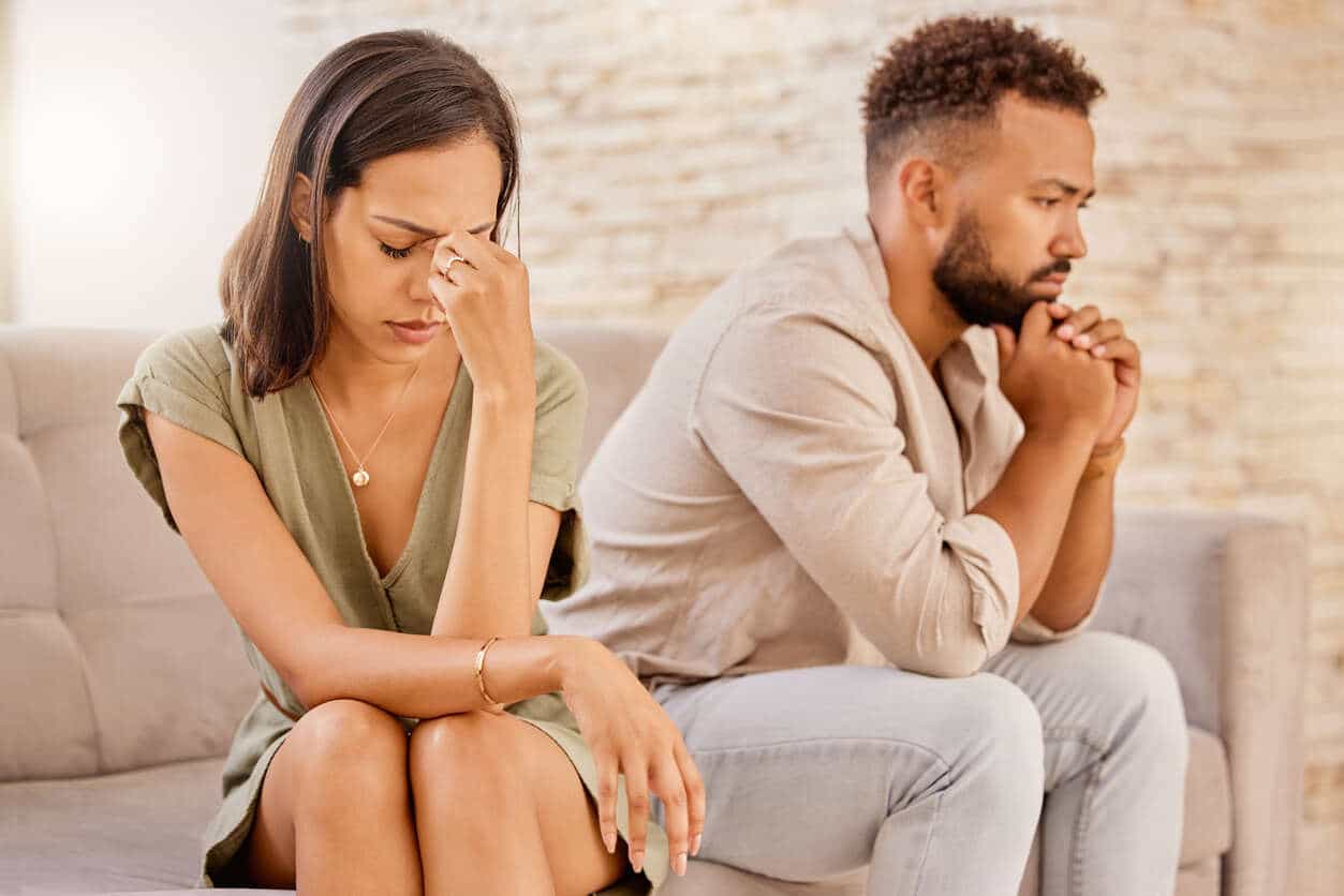 Couple in deep emotional conflict, visually representing the challenges of navigating a difficult divorce when both parties are in disagreement.